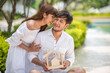 © May Chanikran - Young Asian couple holding home model with happily.
