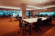 © .shock - Empty interior of big modern security system control room, workstation with multiple displays, monitoring room with at security data center Empty office, desk, and chairs at a main CCTV security data