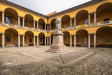 Courtyard Of University Of Pavia With Statue Of Alessandro Volta. It Is Considered One Of The Oldest University In The World.