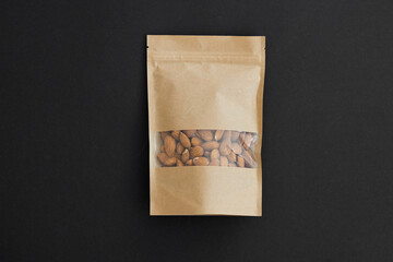 Wall Mural - Almond in a package on a black background