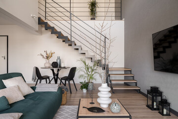 Living room with table and staircase