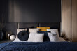 Leinwandbild Motiv Stylish bed in modern dark bedroom