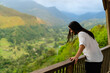 young latin long-haired man at a viewpoint in colombia Quindio, enjoying the mountainous scenery. copy space