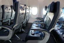 Passenger Plane Interior Details. Empty Seats With Safety Belts. A Moment Before Passengers Board
