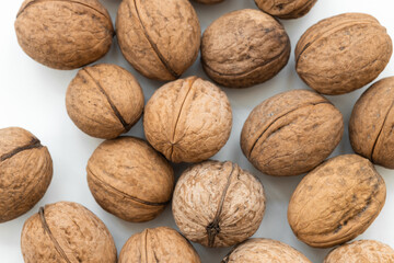 Wall Mural - walnuts in shell isolated on a white background