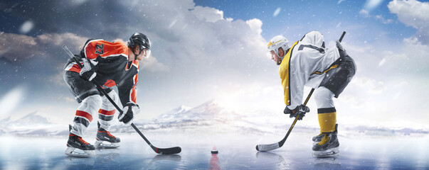 Wall Mural - Hockey concept. Two professional hockey players start the game in ice. Fight for the puck. Sports emotions. Winter