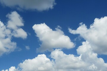 Wall Mural - Beautiful shaped clouds in blue sky, natural background