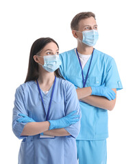 Wall Mural - Medical assistants in protective masks on white background