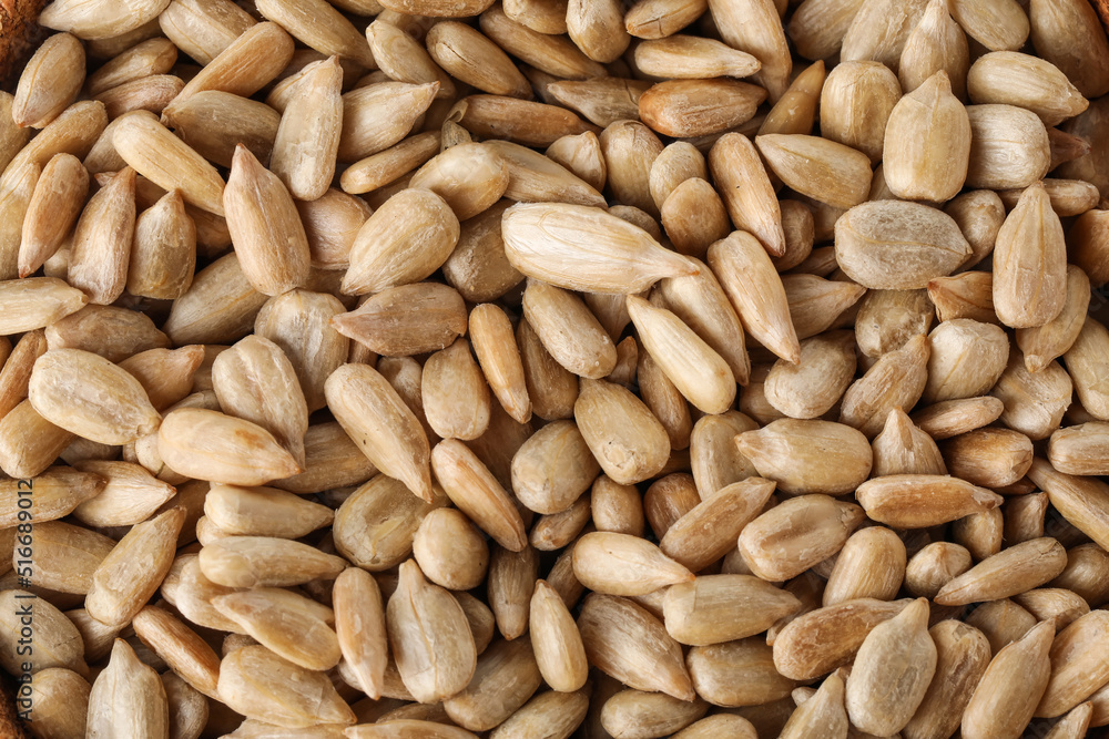 Closeup view of peeled sunflower seeds as background