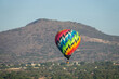 Isolated Colorful Hot Air Balloon Flying Over Ancient Pyramid of Teotihuacan, Mexico