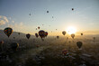 Colorful Hot Air Balloons Flying Over Ancient Pyramid of Teotihuacan, Mexico at sunrise -sunset, over the mist