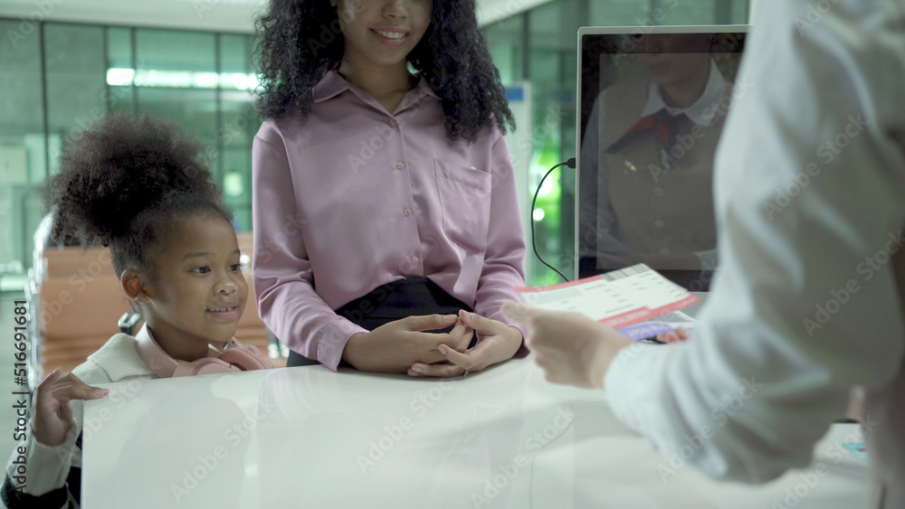 passengers at check-in counter in the domestic airport terminal, domestic passengers making a check-in and loading their luggage and suitcase to the airline.