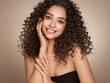 © Oleg Gekman - Fashion studio portrait of beautiful smiling woman with afro curls hairstyle. Fashion and beauty