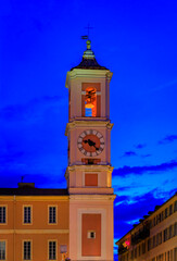 Poster - The colorful Caserne Rusca clock tower at the blue hour of sunset in the Old Town, Vieille Ville of Nice, French Riviera in the South of France