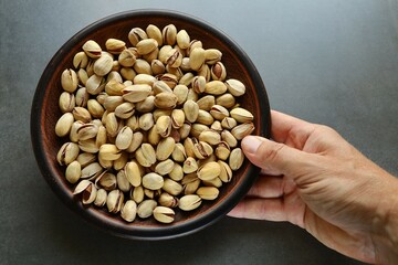 Poster - Pistachio nuts. Pistachios in a plate.