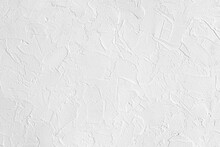 Abstract Background Of White Embossed Plastered Wall Painted White Close Up