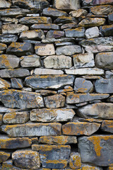 Wall Mural - Old castle stone wall texture background.  Vertical shot