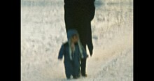 Mother With Small Child In Snow Winter Park. Woman Walks With Little Baby In Frosty Winter Forest. Family Walks In Cold Winter. Lifestyle Outdoors. Vintage Color Film. Family Archive. Retro 1980s. 4k