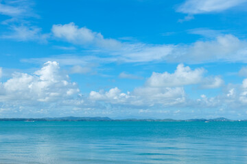 Wall Mural - Turquoise sea background with blue sky fluffy cloud nature landscape