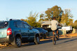 © Austockphoto - teen boy doing wheelie on bicycle on quiet street