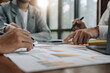© Natee Meepian - Business team colleagues meeting to conference professional investor working a new marketing business strategy project discussion and analysis data chart and graph, finance and accounting concept.