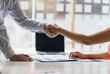 © Wasan - Handshake. Financial advisors and accountants shaking hands at the meeting. The concept of working together for people in the organization.