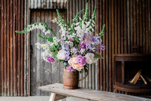 Beautiful Flowers Set Up By A Florist For A Photoshoot In An Old Barn