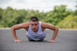 © Ben Gingell - A Nineteen Year Old Teenage Boy Doing Push Ups A Public Park