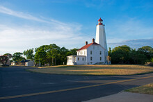 Lighthouse In Sandy Hook, New Jersey, In Late Afternoon With Shadows Coming Up On It, And A Cirrus Cloud Filled Sky -71