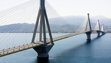 Aerial Drone Shot Of Cable Strayed Bridge Over Sea Also Known As Charilaos Trikoupis Rio - Antirio Bridge Which Connects Greece Mainland With Peloponnese.