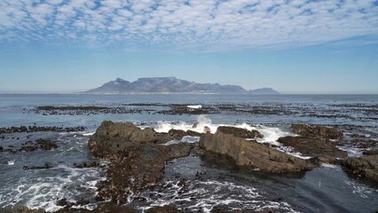 Wall Mural - Establishing shot showing Cape Town, South Africa, as seen from Robben Island.