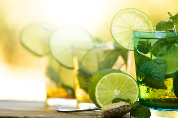 Poster - glass of mojito with lime, mint and brown sugar