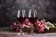 © zhikun sun - wine glass with red wine on wooden table