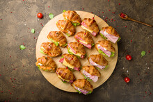 Mini Croissant With Salmon And Cheese, Mini Croissant With Ham, Mini Croissant With Sausage Top View, Canapes