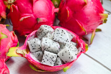 Wall Mural - fresh white dragon fruit tropical in the asian thailand healthy fruit concept, dragon fruit slice on fruit peel with pitahaya background