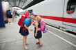 © FOLIO - Sisters kissing at train station