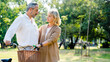 © Rapeepat - Senior Caucasian couple hugging in park. Family with a happy smile feels relaxed with nature in the morning. Or in the evening. Enter elderly society And retire from work. Concept health insurance