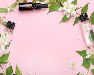 Sticker - Bottles of essential oil with jasmine flowers.