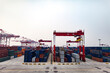 © FOLIO - Cargo and shipping containers at port