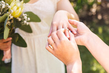 Image Of Hands Of Diverse Lesbian Women Putting On Wedding Ring