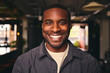 © Southworks - Smiling Young Black Male Standing In Office Looking At Camera