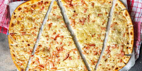 Flammkuchen savory pie bacon, onion, sour cream pastrie pie fresh meal food snack on the table copy space food background rustic