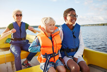 Family In Boat On Lake