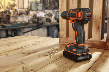 Wall Mural - Black and orange drill and workshop interior. 