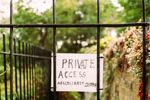 Ad Hoc Private Access Sign Seen Attached To A Wrought Iron Gate For Access To A Private Fishing Club. Beyond The Gate Is A Popular Fresh Water Stream For Salmon And Trout.
