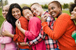 © DisobeyArt - Young multiracial women having fun laughing together outdoor - Focus on african girl face