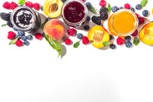 Assortment Of Berries And Fruits Jams In Jars