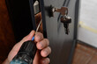 Installation of lock and door handle to interior doors, locksmith works with doors.