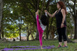 © Amilciar - Latin American mom and daughter have fun in the park doing balancing exercises together