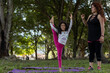© Amilciar - Latin American mom and daughter have fun in the park doing balancing exercises together